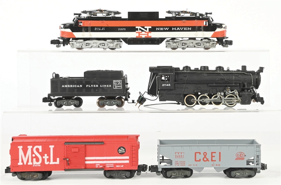 AMERICAN FLYER S. GAUGE NO. 21145 AND NO. 21573 LOCOMOTIVES PLUS TWO FREIGHT CARS