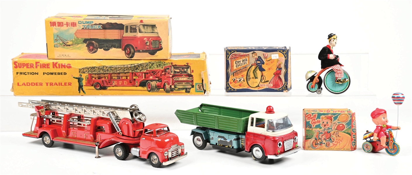 LOT OF 4: SUPER FIRE KING LADDER TRAILER, DUMP TRUCK, BELL CYCLE AND GAY 90S CYCLIST W/ BOXES