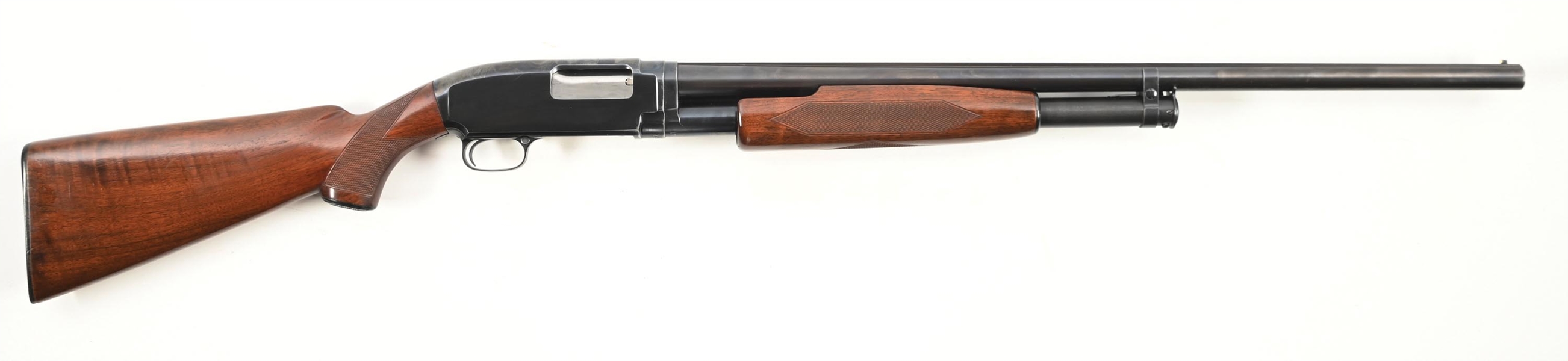 (C) DELUXE WINCHESTER MODEL 12 SLIDE ACTION SHOTGUN.