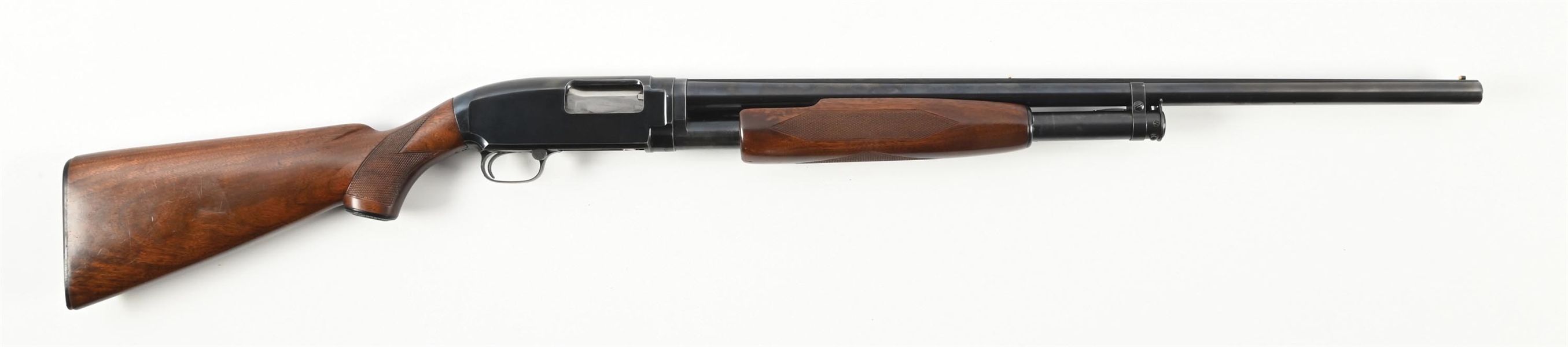 (C) WINCHESTER MODEL 12 SLIDE ACTION SHOTGUN.