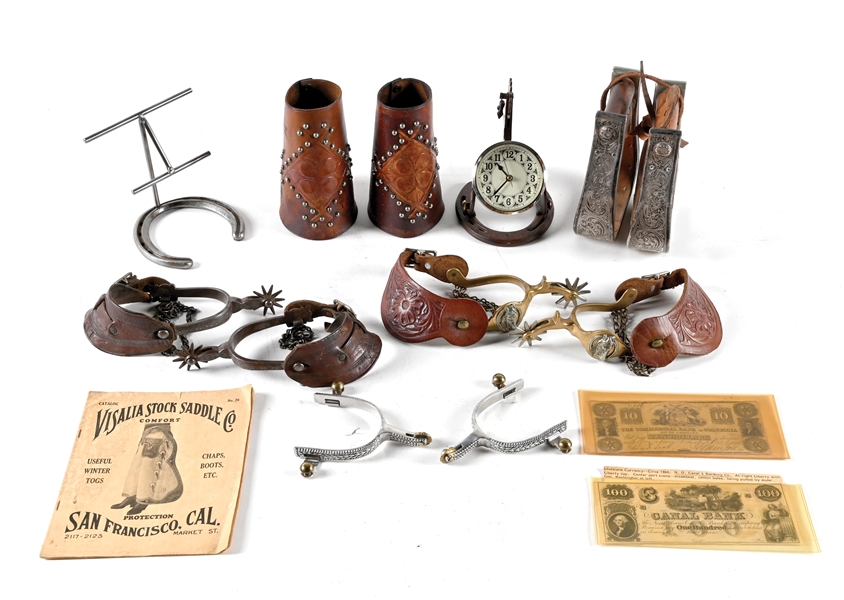LOT OF 9: VARIOUS SPURS, CUFFS, HORSESHOE CLOCK, LITERATURE AND TWO 10 & 100 DOLLAR BILLS
